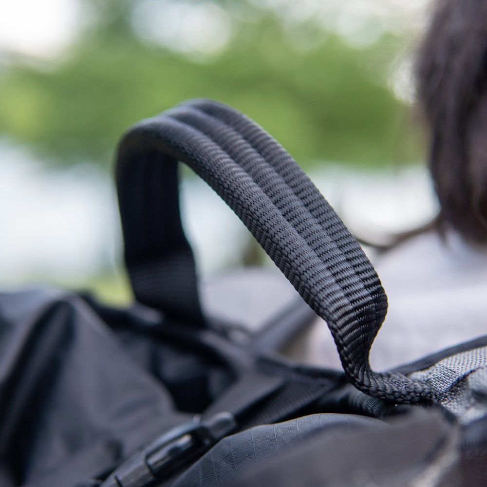 Backpacker looks in spacious inner compartment of ULTRA Spare Tire Fanny Pack