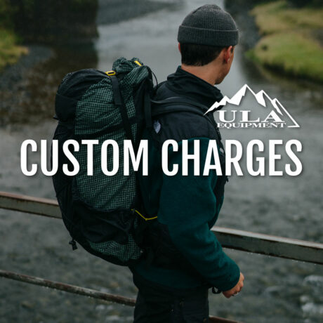Custom Charges for ULA add-ons and custom features. Image says "Custom Charges" displays ULA logo in white. Background shows a hiker wearing a ULA pack.