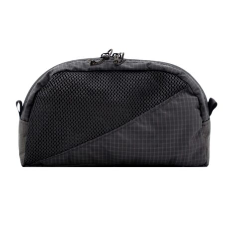 Outside, front view of toiletries kit. It is tombstoned shape and the front is half mesh, have UltraGrid. It is zipped closed.